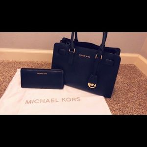 Black Michael Kors purse with a matching wallet